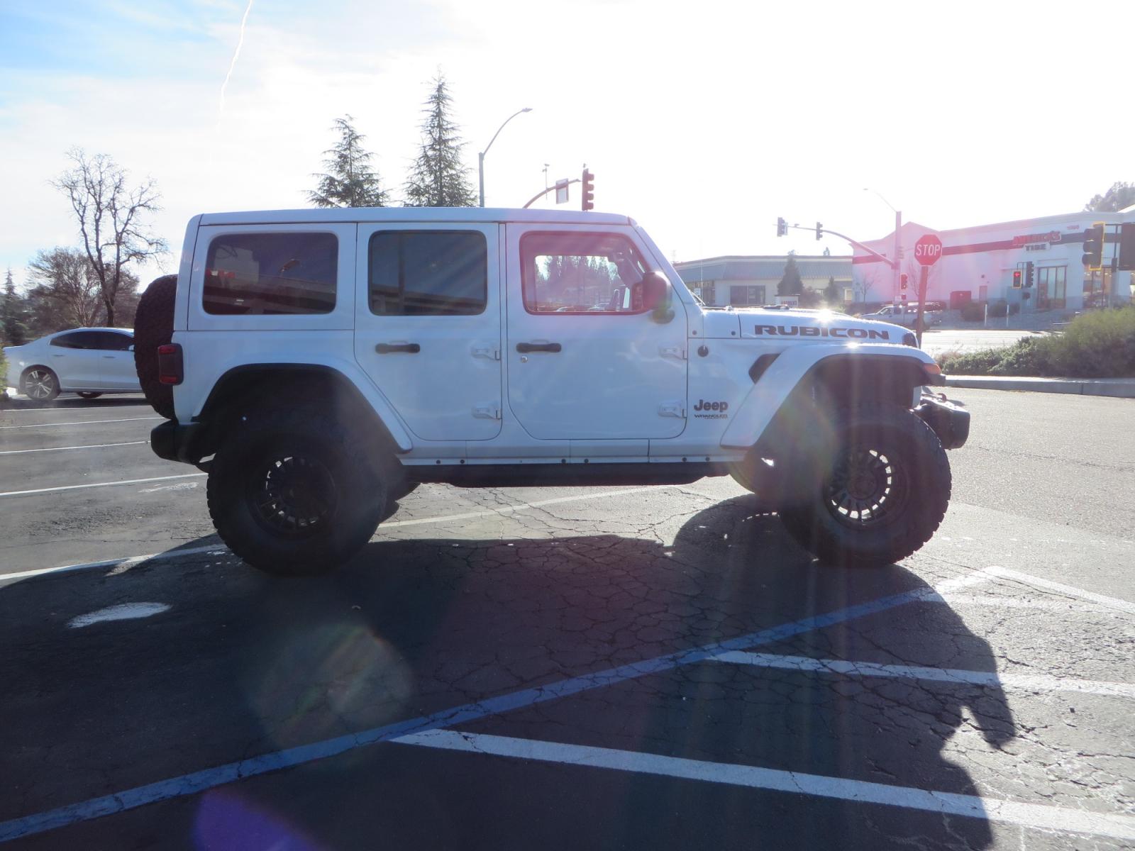 2020 White /TAN Jeep Wrangler Unlimited Rubicon (1C4HJXFG8LW) with an 3.6L V6 DOHC 24V FFV engine, 6A transmission, located at 2630 Grass Valley Highway, Auburn, CA, 95603, (530) 508-5100, 38.937893, -121.095482 - 3" Zone offroad suspension system, Fox adventure series shocks, rocksliders, Teraflex HD tire relocation, Mopar HD tailgate hinge, 17" KMC wheels, and 37" BFG KO2 tires. - Photo #3